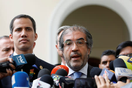 Italian ambassador to Venezuela Silvio Mignano delivers a news conference next to Venezuelan opposition leader Juan Guaido, who many nations have recognized as the country's rightful interim ruler, and accredited diplomatic representatives of the European Union in Caracas, Venezuela February 19, 2019. REUTERS/Marco Bello