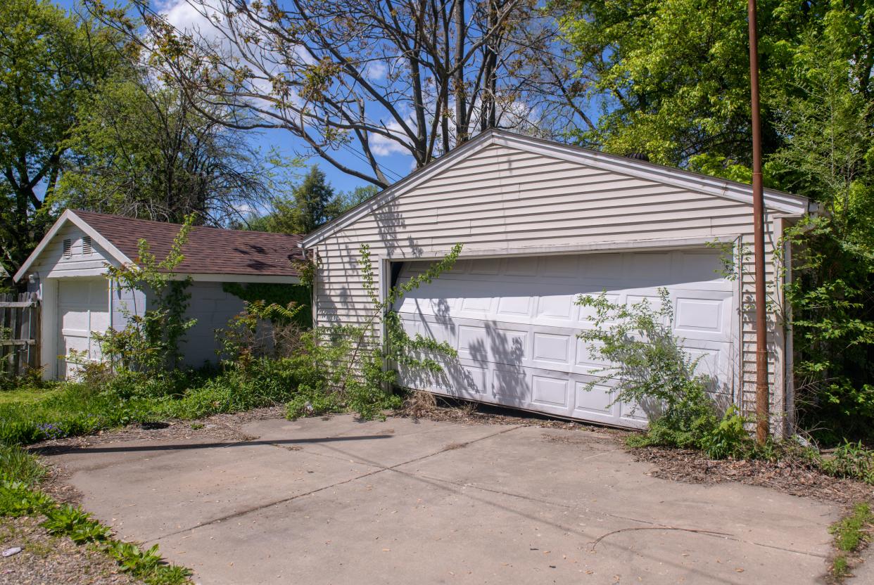 A dilapidated garage sits in an alleyway on Peoria's East Bluff.