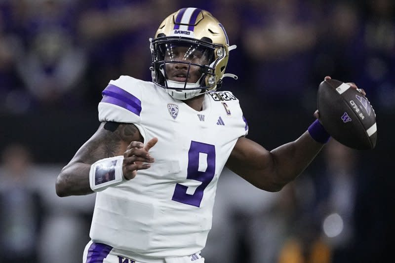 Washington Huskies quarterback Michael Penix Jr. drops back to pass against the Michigan Wolverines in the fourth quarter of the 2024 College Football Playoff national championship game Monday at NRG Stadium in Houston. Photo by Kevin M. Cox/UPI