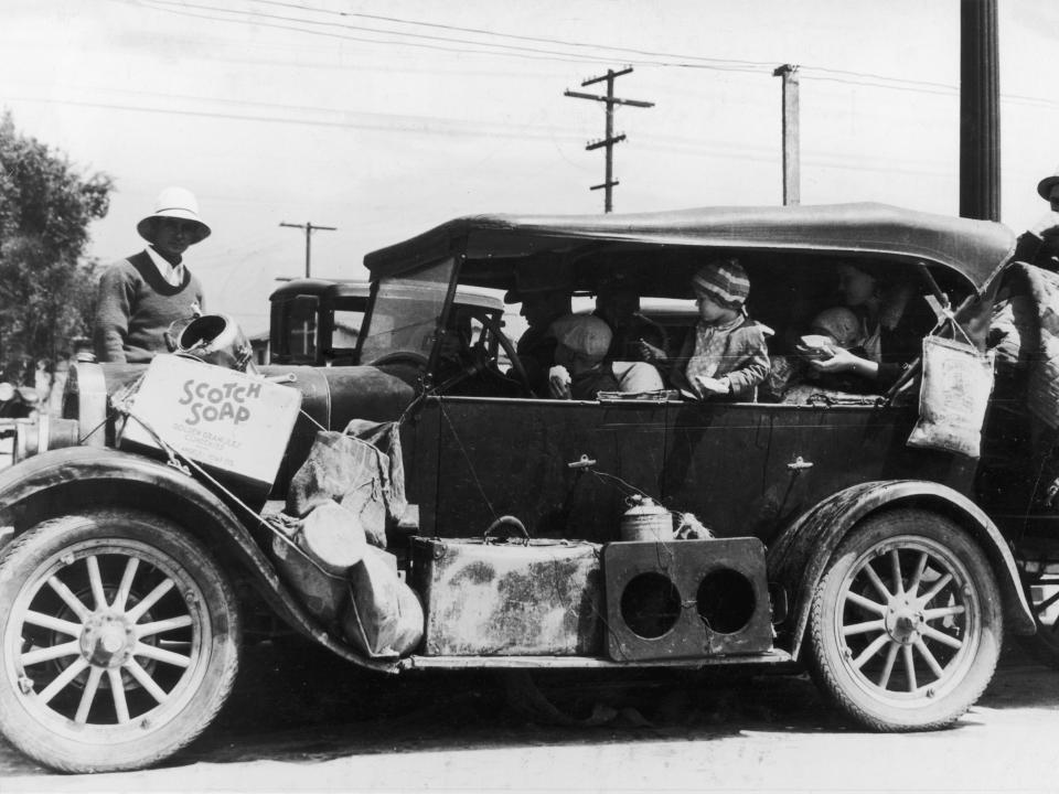 A car full of refugees from the Dust Bowl look for work in San Francisco, California in 1933.