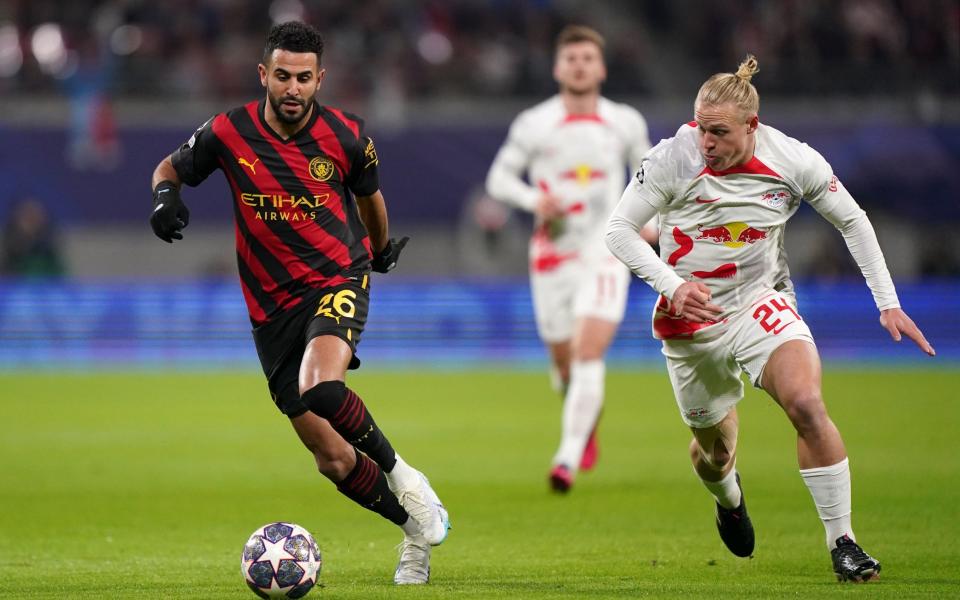 Manchester City's Riyad Mahrez (left) and RB Leipzig's Xaver Schlager in action during the Champions League - PA/Tim Goode