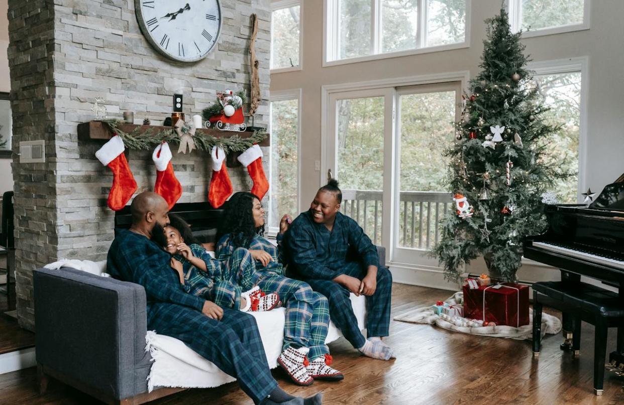 Helen, Georgia is a great place to visit for Christmas. pictured a black family in Georgia getting ready for Christmas.