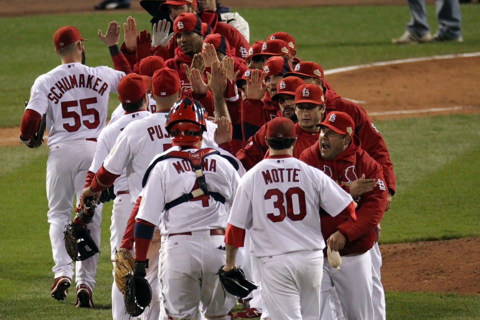 ST LOUIS, MO - OCTOBER 19: The St. Louis Cardinals celebrate after defeating the Texas Rangers 3-2 during Game One of the MLB World Series at Busch Stadium on October 19, 2011 in St Louis, Missouri. (Photo by Jamie Squire/Getty Images)