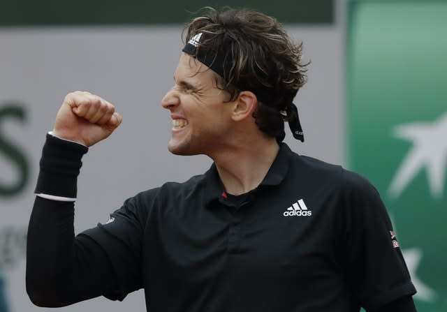 Dominic Thiem celebrates winning his second-round match