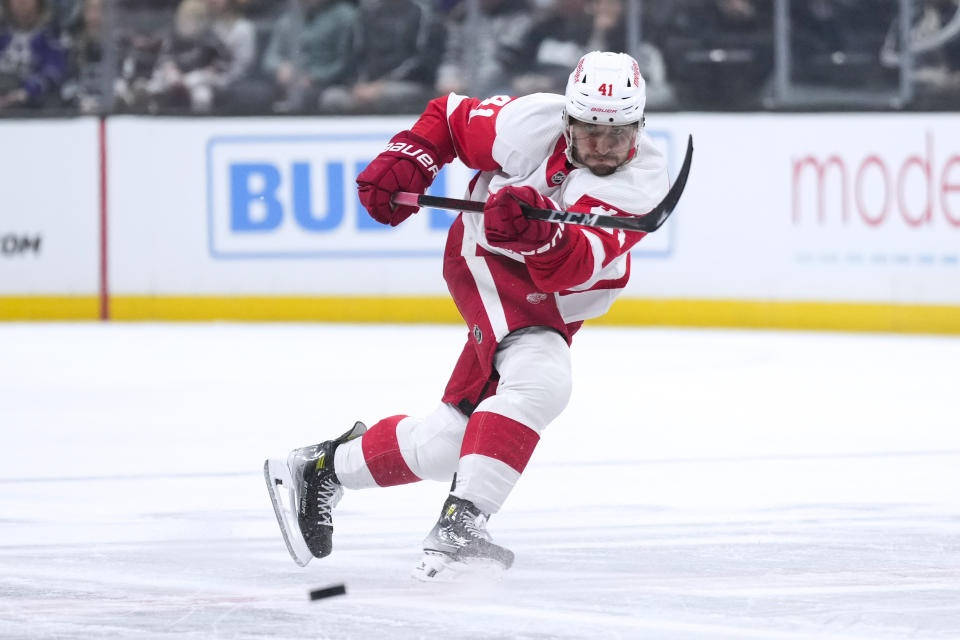 Detroit Red Wings defenseman Shayne Gostisbehere sends the puck ahead uring the first period of the team's NHL hockey game against the Los Angeles Kings on Thursday, Jan. 4, 2024, in Los Angeles. (AP Photo/Jae C. Hong)