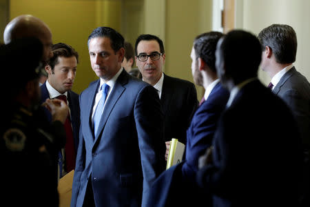 U.S. Treasury Secretary Steve Mnuchin (C) leaves after it was reported House Majority Leader Steny Hoyer (D-MD) would ask the Treasury Department to delay the lifting of sanctions on two companies tied to Russian oligarch Oleg Deripaska to give Congress time to review the decision in Washington, U.S., January 15, 2019. REUTERS/Yuri Gripas