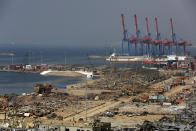 The port area lies in devastation following this week's massive explosion in the port of Beirut, Lebanon, Friday, Aug. 7, 2020. Rescue teams were still searching the rubble of Beirut's port for bodies on Friday, nearly three days after a massive explosion sent a wave of destruction through Lebanon's capital. (AP Photo/Thibault Camus)