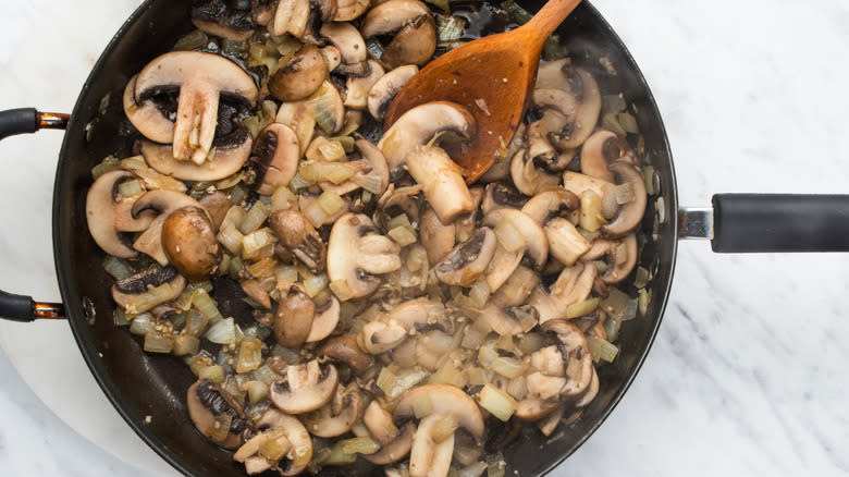 Mushrooms cooking in pan 