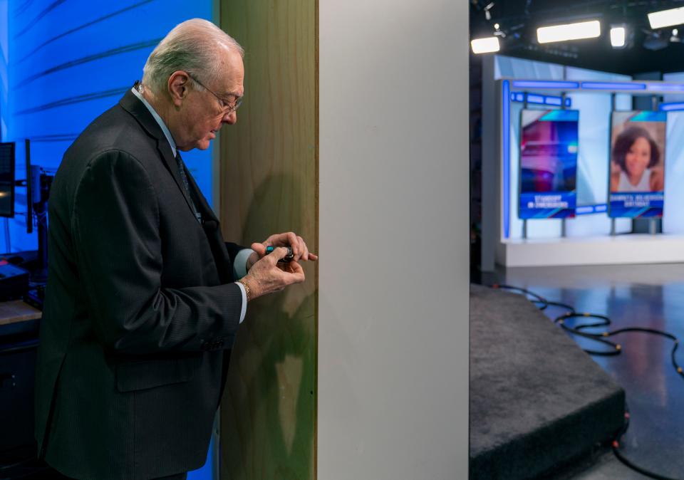 Eyewitness News Lead Anchor Brad Byrd prepares his microphone for the evening programs Tuesday, March 14, 2023. 