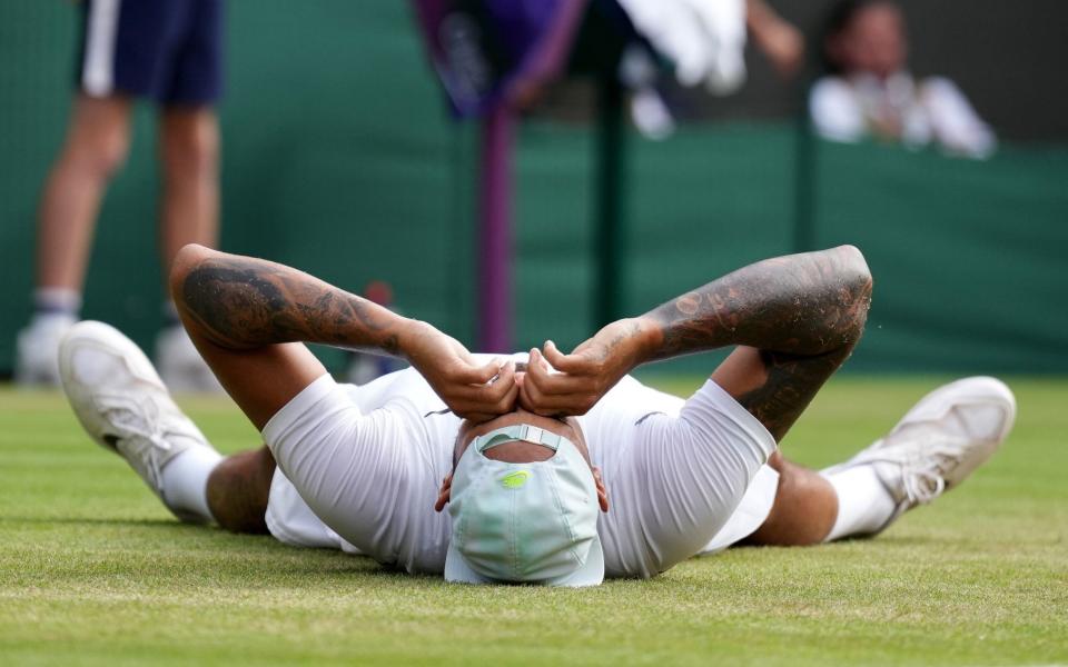 Nick Kyrgios celebrates victory over Cristian Garin in the the Gentlemen's Quarter Final on day ten of the 2022 Wimbledon Championships at the All England Lawn Tennis and Croquet Club, Wimbledon. - Zac Goodwin/PA