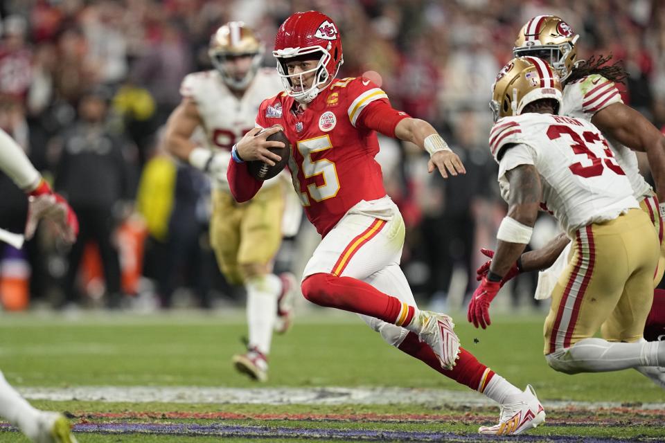 Kansas City Chiefs quarterback Patrick Mahomes (15) scrambles against the San Francisco 49ers during overtime in the NFL Super Bowl 58 football game Sunday, Feb. 11, 2024, in Las Vegas. (AP Photo/Eric Gay)