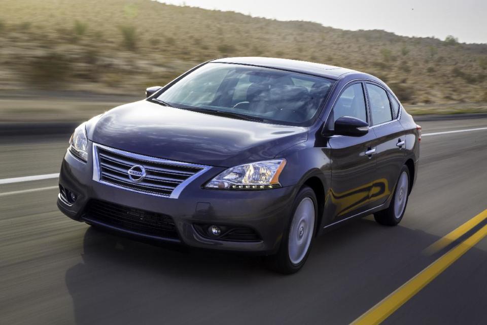 This undated photo provided by Nissan shows the 2013 Nissan Sentra. The company says the new car is 150 pounds lighter than the old one, yet has more interior room. It also has a smoother, quieter engine. The car goes on sale in the fall and will compete against the top sellers in the segment, the Honda Civic and Toyota Corolla. (AP Photo/Nissan, Bruce Benedict)