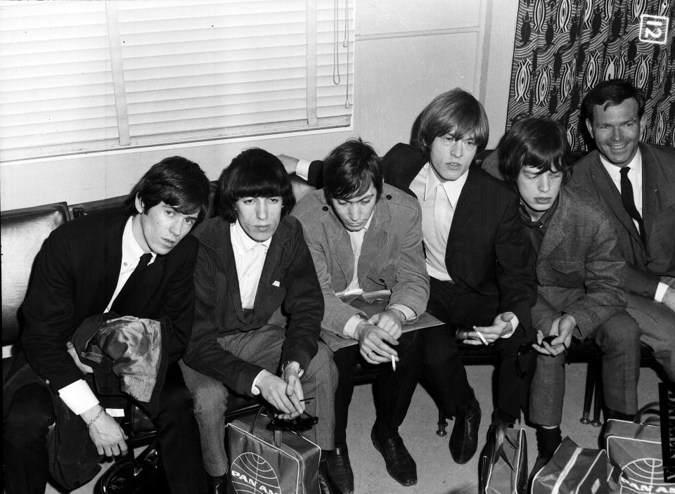 The Rolling Stones are interviewed by Mike Walsh shortly after arriving at Mascot Airport, January 21 1965. (Photo by Trevor Dallen/The Sydney Morning Herald/Fairfax Media via Getty Images).