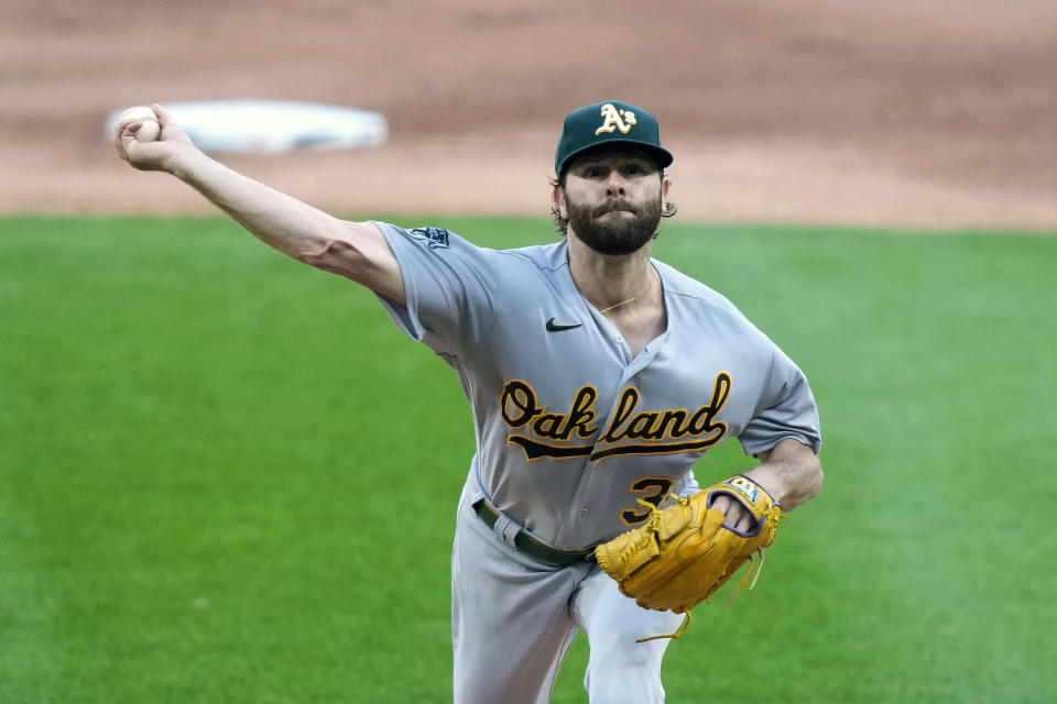 Oakland Athletics starting pitcher Zach Neal delivers during the first inning of a baseball game against the Chicago White Sox, Friday, Aug. 25, 2023, in Chicago. (AP Photo/Charles Rex Arbogast)