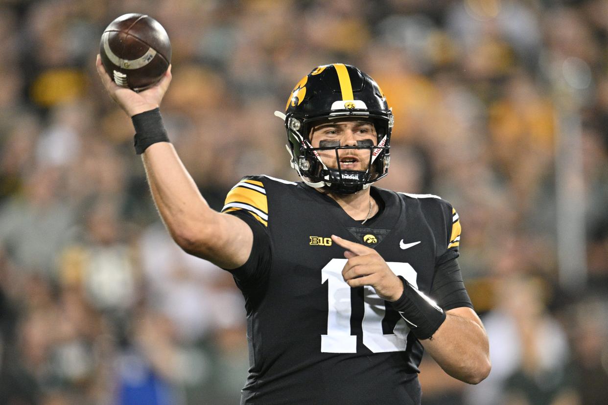 Iowa Hawkeyes quarterback Deacon Hill (10) throws a pass during the first quarter against the Michigan State Spartans at Kinnick Stadium in Iowa City, Iowa, on Saturday, Sept. 30, 2023.