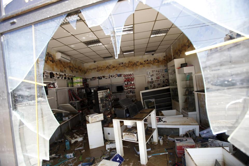 Destroyed electronic shop are seen in the flooded town of Obrenovac