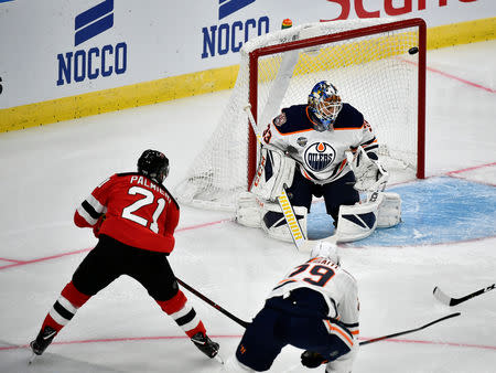 New Jersey Devils' Kyle Palmieri (L) scores during the season-opening NHL Global Series ice hockey match between Edmonton Oilers and New Jersey Devils at Scandinavium in Gothenburg, Sweden October 6, 2018. TT News Agency/Bjorn Larsson Rosvall/via REUTERS