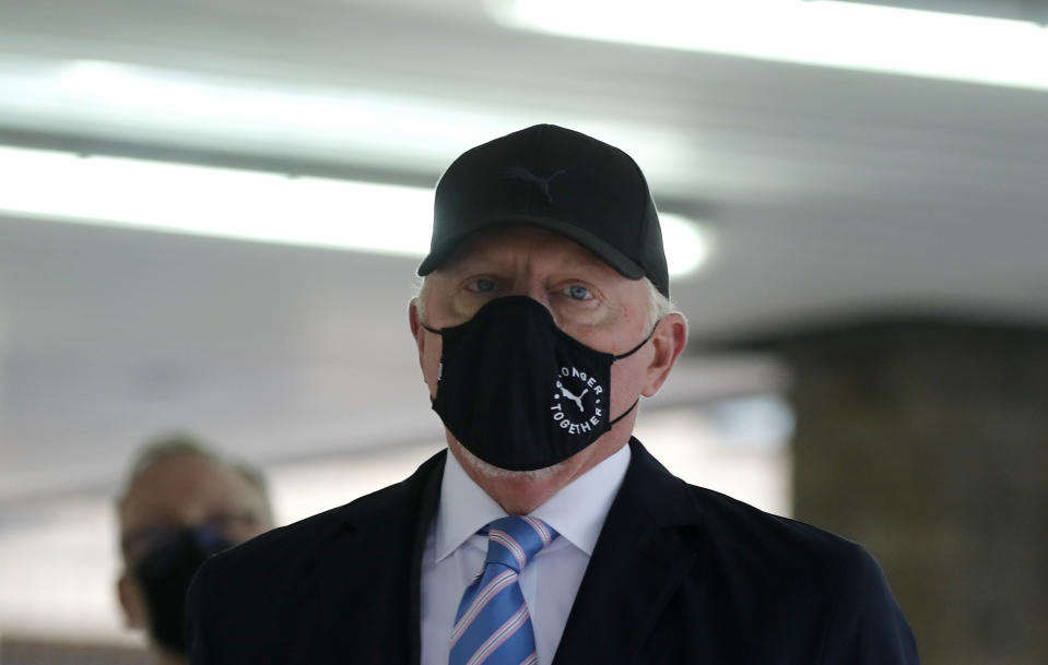 Boris Becker leaves Southwark Crown Court in London, Thursday, Oct. 22, 2020. German tennis star Boris Becker is charged with 19 offences of failing to disclose money and property as part of bankruptcy proceedings. (AP Photo/Frank Augstein)