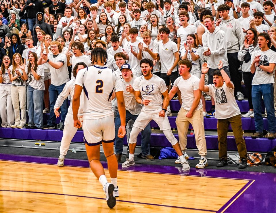 Lexington's Brayden Fogle hypes up the Purple Haze, Lexington High School's student section, during a win over Shelby on Saturday.