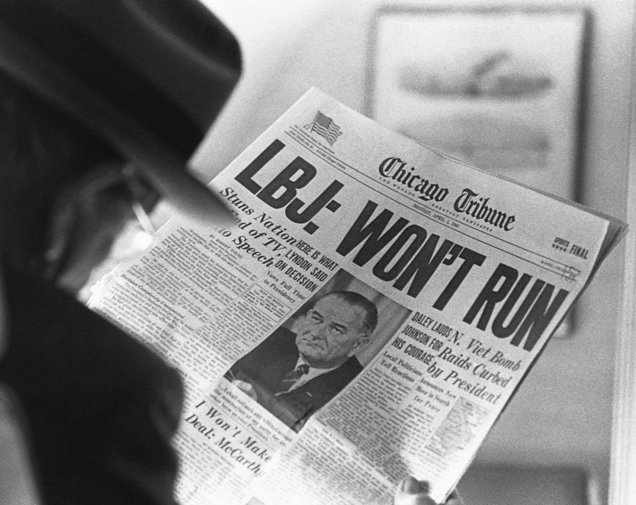 A man reads the Chicago Tribune announcing President Lyndon B. Johnson's decision not to run for reelection in 1968. <a href="https://www.gettyimages.com/detail/news-photo/man-reads-the-news-in-the-april-1-1968-chicago-tribune-news-photo/615297800?adppopup=true" rel="nofollow noopener" target="_blank" data-ylk="slk:Corbis/Getty Images;elm:context_link;itc:0;sec:content-canvas" class="link ">Corbis/Getty Images</a>