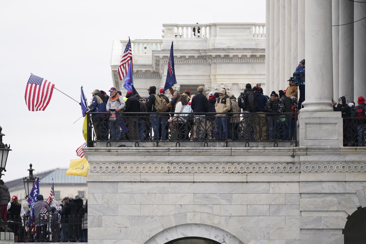 Trump supporters gather outside the Capitol, Wednesday, Jan. 6, 2021, in Washington. As Congress prepares to affirm President-elect Joe Biden&#39;s victory, thousands of people have gathered to show their support for President Donald Trump and his claims of election fraud. (AP Photo/Manuel Balce Ceneta)