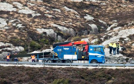 Helicopter rotorblades are brought away from Turoy outside Bergen, where a helicopter crashed Friday April 29. Torstein Boe/NTB Scanpix/via Reuters