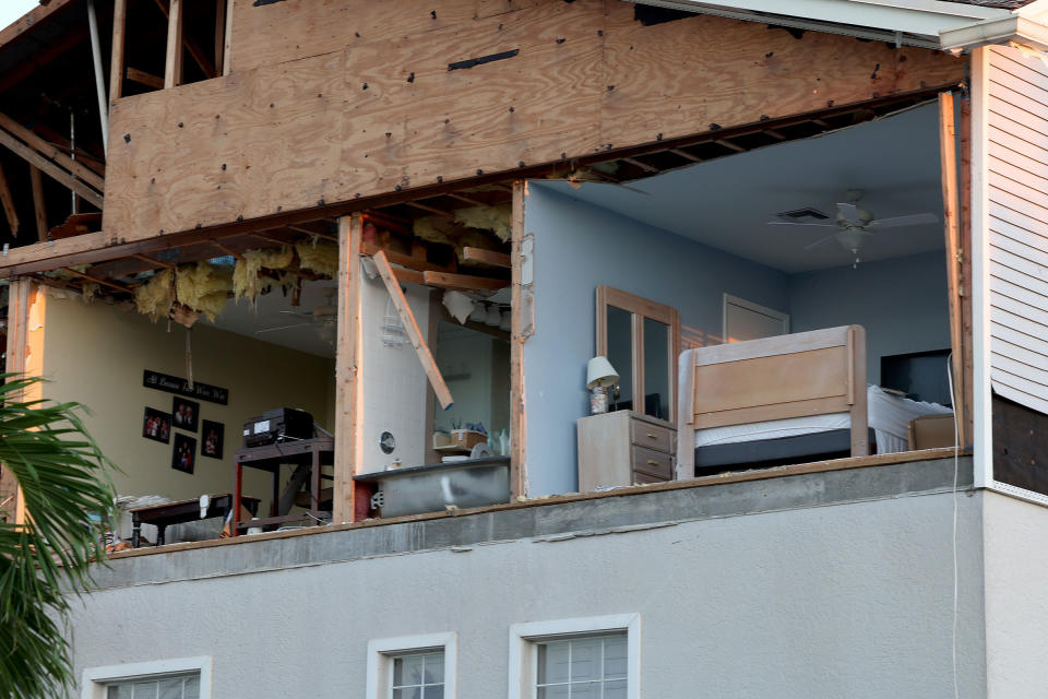 A wall of a condo was torn off as hurricane Ian passed through on Sept. 30 in Fort Myers, Fla.<span class="copyright">Joe Raedle—Getty Images</span>