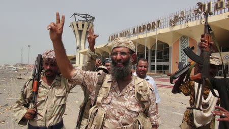 Southern Resistance fighters flash the victory sign at the international airport of Yemen's southern port city of Aden, July 14, 2015. REUTERS/Stringer