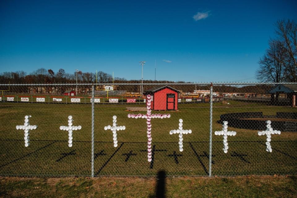 Crosses can be seen along a fence at Tuscarawas Valley Local Schools after the funeral service for Jeffery 'JD' David Worrel on Saturday, Nov. 18, at Wilkshire Event Center in Bolivar.