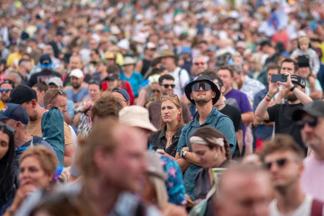 Crowds watch Michael Eavis perform on the Park stage