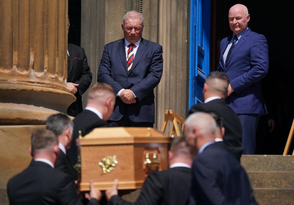 Former Rangers players Ally McCoist and John Brown watch the coffin arrive ahead of the funeral service (Andrew Milligan/PA) (PA Wire)