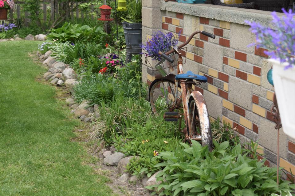 The home garden of Adrian’s Kim Baumea, 158 Budlong St., has been recognized as the Garden of the Month for May by the Adrian Women’s Garden Club. The ferns on the side of the house are low maintenance and do well in the shady part of the yard, according to the Adrian Garden Club and representative Cheryl Lynch.