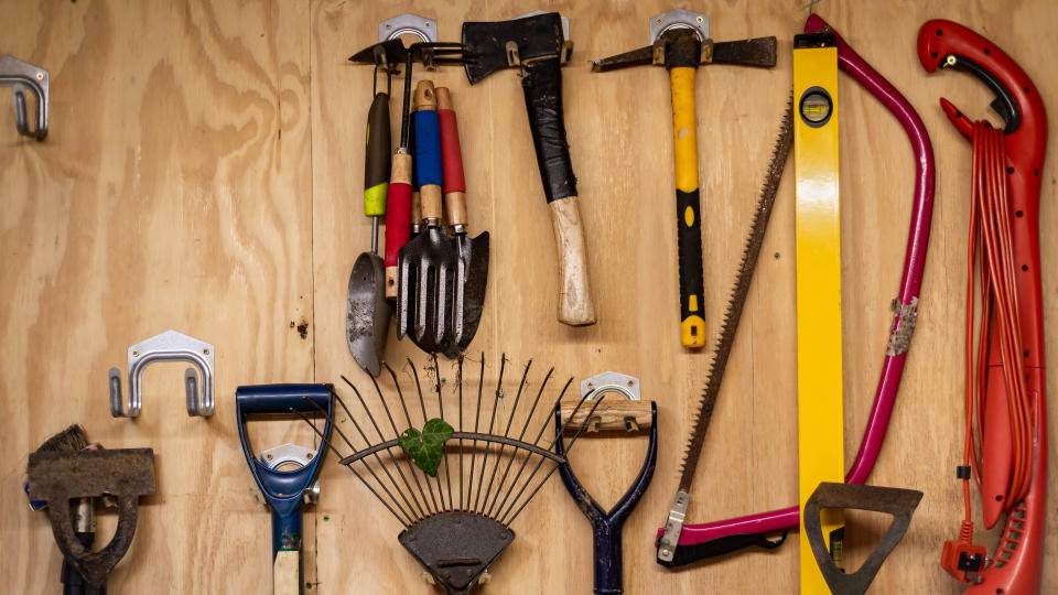 Garden tools on door hooks