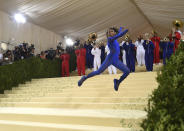 Nia Dennis and the Brooklyn United marching band attend The Metropolitan Museum of Art's Costume Institute benefit gala celebrating the opening of the "In America: A Lexicon of Fashion" exhibition on Monday, Sept. 13, 2021, in New York. (Photo by Evan Agostini/Invision/AP)