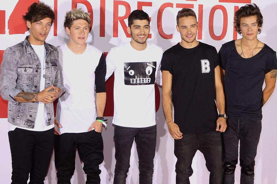 <p>Jo Hale/Redferns via Getty</p> One Direction poses for a photo at the One Direction 