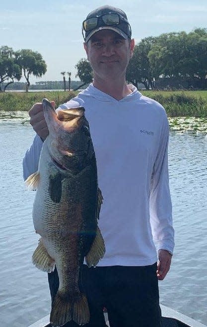 Jay Helmuth came down from Minnesota, went fishing with Capt. James Hillman out of Highland Park in DeLand, and here's the 10-pound result. The big bass was quickly released.