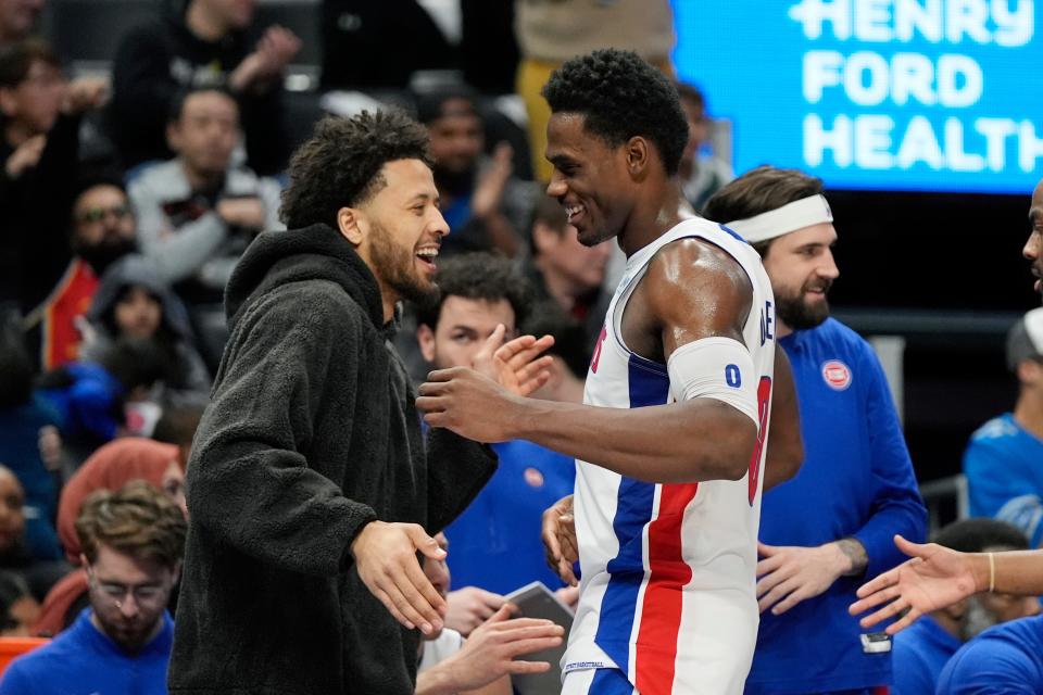 Detroit Pistons center Jalen Duren is greeted by guard Cade Cunningham after the second half against the Oklahoma City Thunder at Little Caesars Arena in Detroit on Sunday, Jan. 28, 2024.