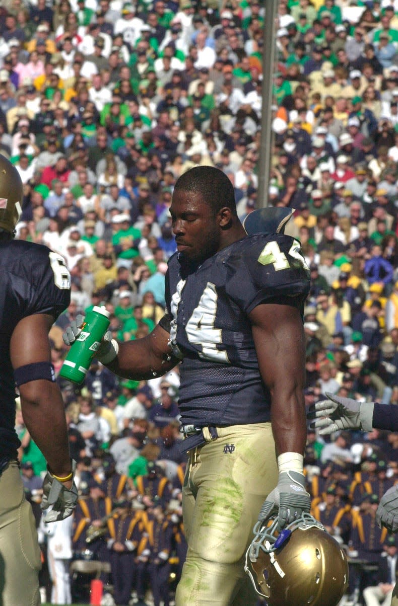 Notre Dame's Justin Tuck takes a drink during a break in action during his Irish playing days. nTribune file photo/FRED DODD