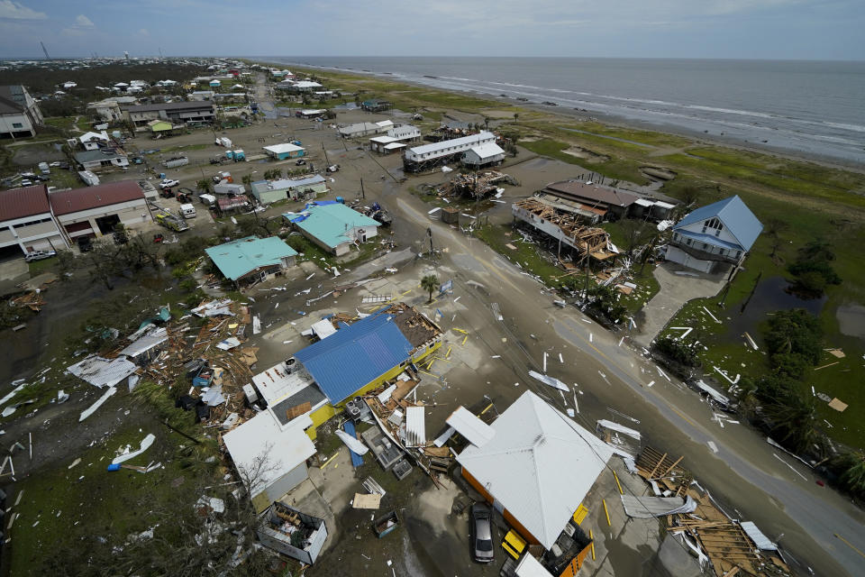 The remains of destroyed homes and businesses are seen in the aftermath of Hurricane Ida in Grand Isle, La., Tuesday, Aug. 31, 2021. (AP Photo/Gerald Herbert)