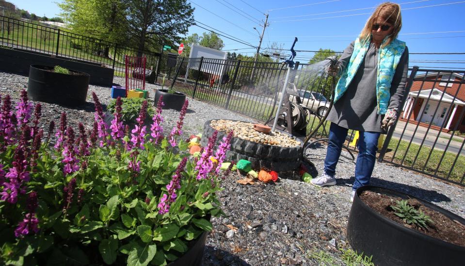 Julie Heath works in the Highland Community Garden on North York Street in Gastonia Tuesday morning, April 19, 2022.