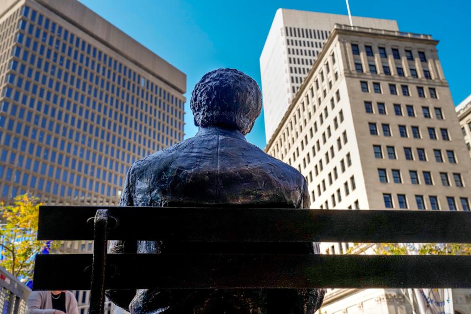 A new statue of 19th-century landscape painter Edward Mitchell Bannister faces downtown Providence from his riverside bench in Market Square.