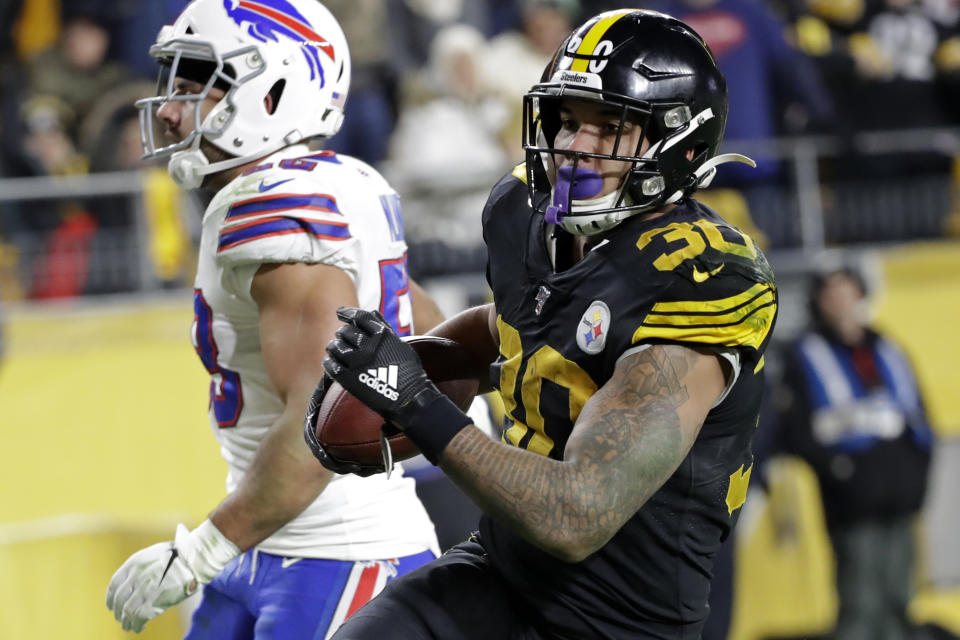 Pittsburgh Steelers running back James Conner (30) scores during the second half of an NFL football game against the Buffalo Bills in Pittsburgh, Sunday, Dec. 15, 2019. (AP Photo/Don Wright)