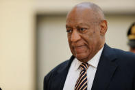 Actor and comedian Bill Cosby is helped through the metal detector as he arrives for the first day of his sexual assault trial at the Montgomery County Courthouse in Norristown, Pennsylvania, U.S. June 5, 2017. REUTERS/David Maialetti/Pool