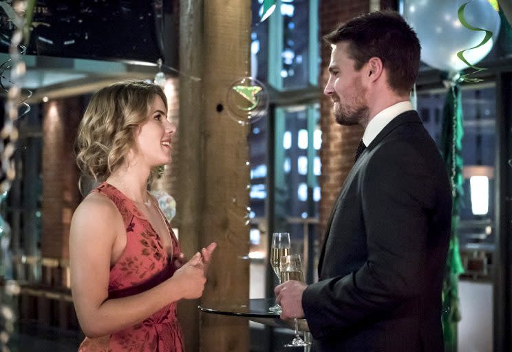 Emily Bett Rickards as Felicity Smoak and Stephen Amell as Oliver Queen/The Green Arrow in The CW’s Arrow.