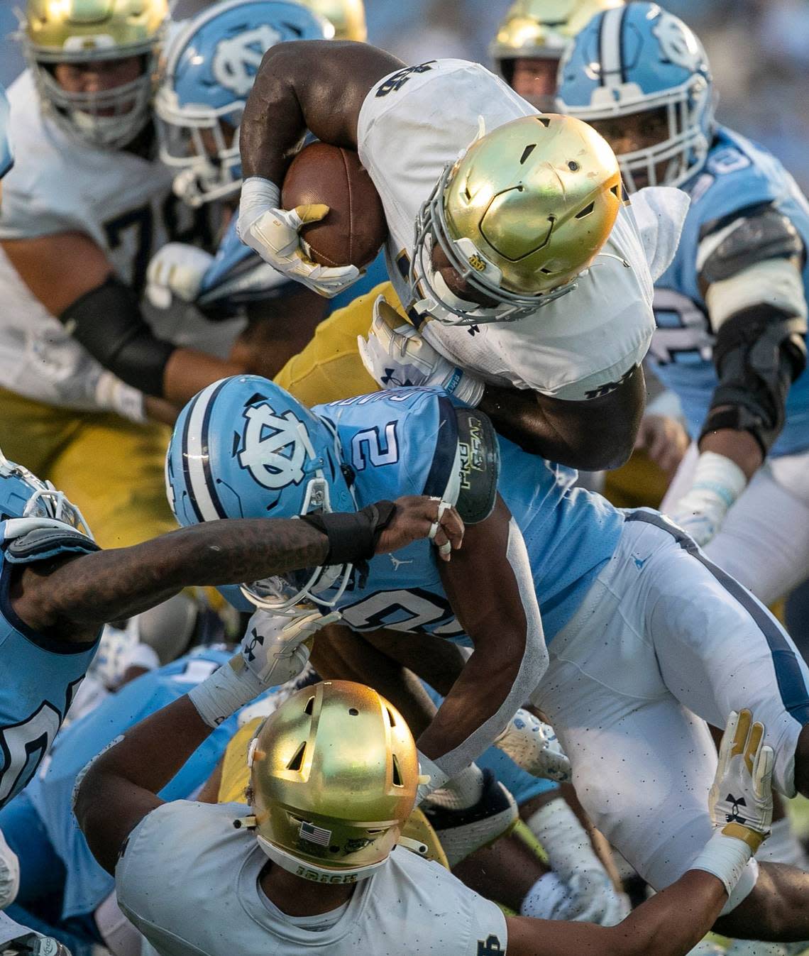 Notre Dame’s Audric Estime (7) tries to score on a seven-yard carry before fumbling on the goal line, turning the ball over to North Carolina late in the fourth quarter on Saturday, September 24, 2022 at Kenan Stadium in Chapel Hill, N.
