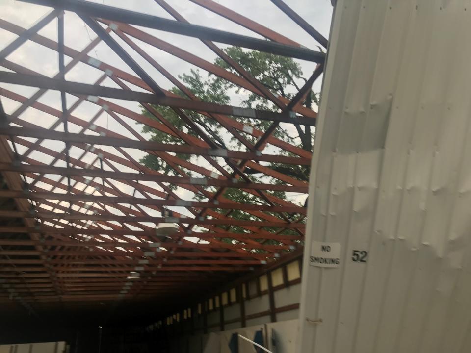 Friday's severe thunderstorm produced extensive damage around the city with a microburst containing estimated straight line winds of up to 75 miles per hour, Sandusky County Emergency Management Agency Director Lisa Kuelling said Tuesday. The storm blew part of the roof off of the open horse barn, pictured here, at the Sandusky County Fairgrounds.