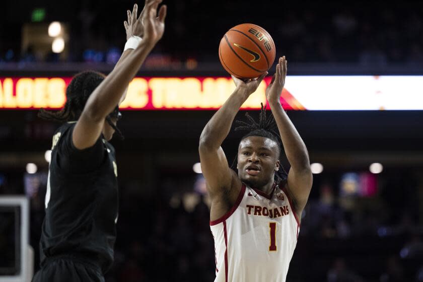 USC guard Isaiah Collier shoots over Colorado forward Cody Williams at Galen Center.