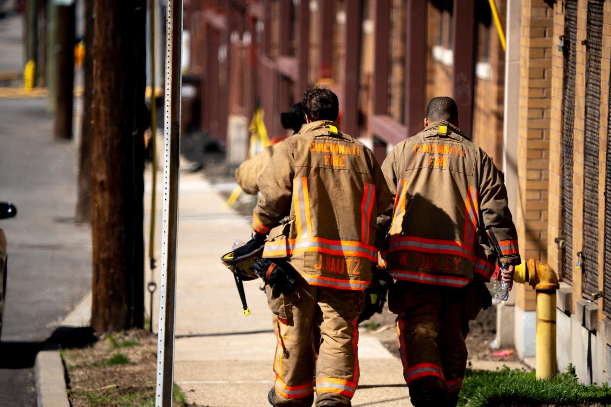 Cincinnati firefighters work to contain a fire on Arlington Street at the intersection of Colerain Avenue earlier this year.
