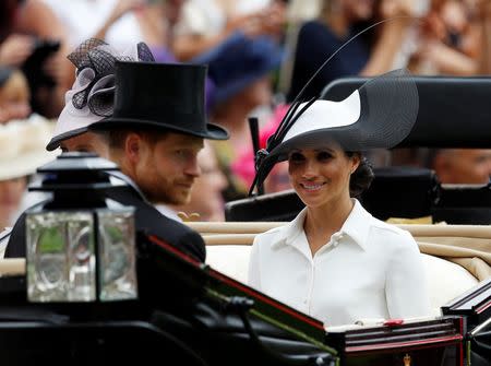 Horse Racing - Royal Ascot - Ascot Racecourse, Ascot, Britain - June 19, 2018 Meghan, the Duchess of Sussex and Britain's Prince Harry arrive at Ascot racecourse REUTERS/Peter Nicholls