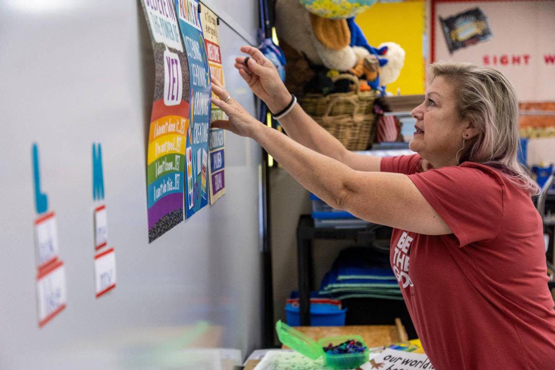 Denise Soufrine decorates her kindergarten classroom on Aug. 8, 2022, as she prepares for Tuesday’s first day of classes at Pembroke Pines Elementary.